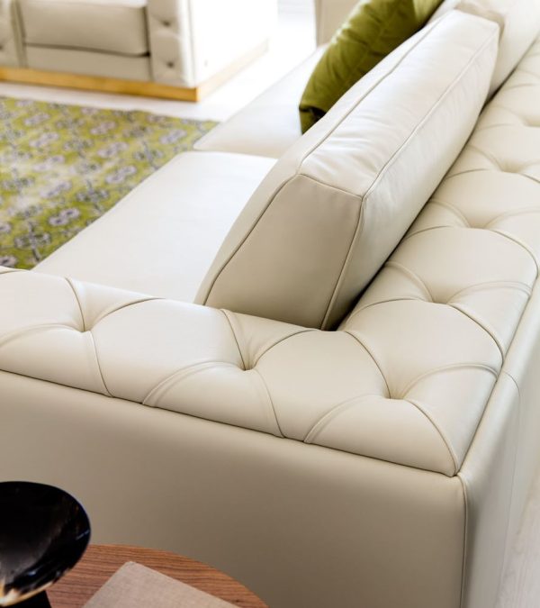 The sleek and contemporary design of this sofa features clean lines and bold angles that create a striking visual impact