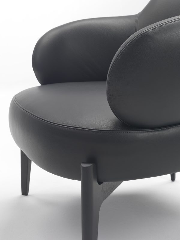 meticulously designed armchair, showcasing refined legs.