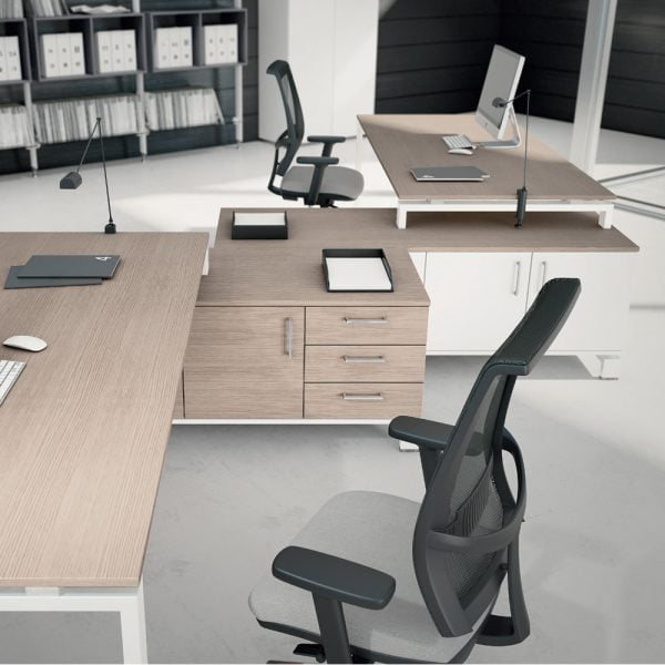 A large L-shaped desk with plenty of storage and work space