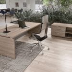 office desk that provides easy access to power outlets and connectivity options for managers..