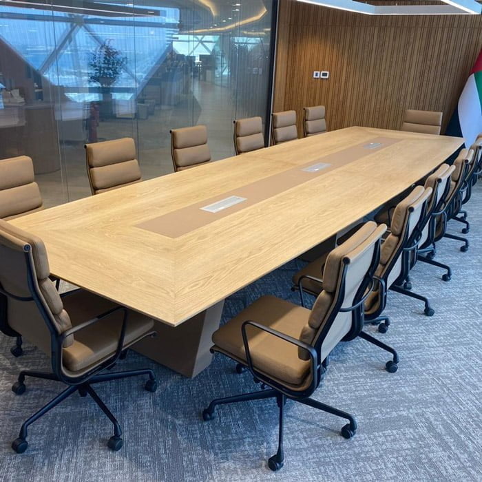 Wooden meeting room table with built-in sockets