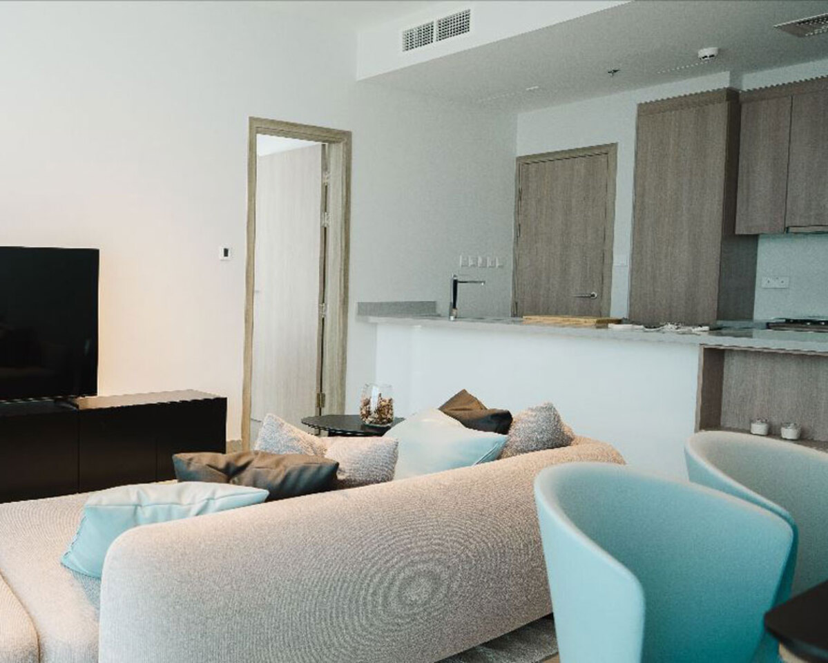 The apartment boasts modern interiors with sleek furniture and minimalist decor.