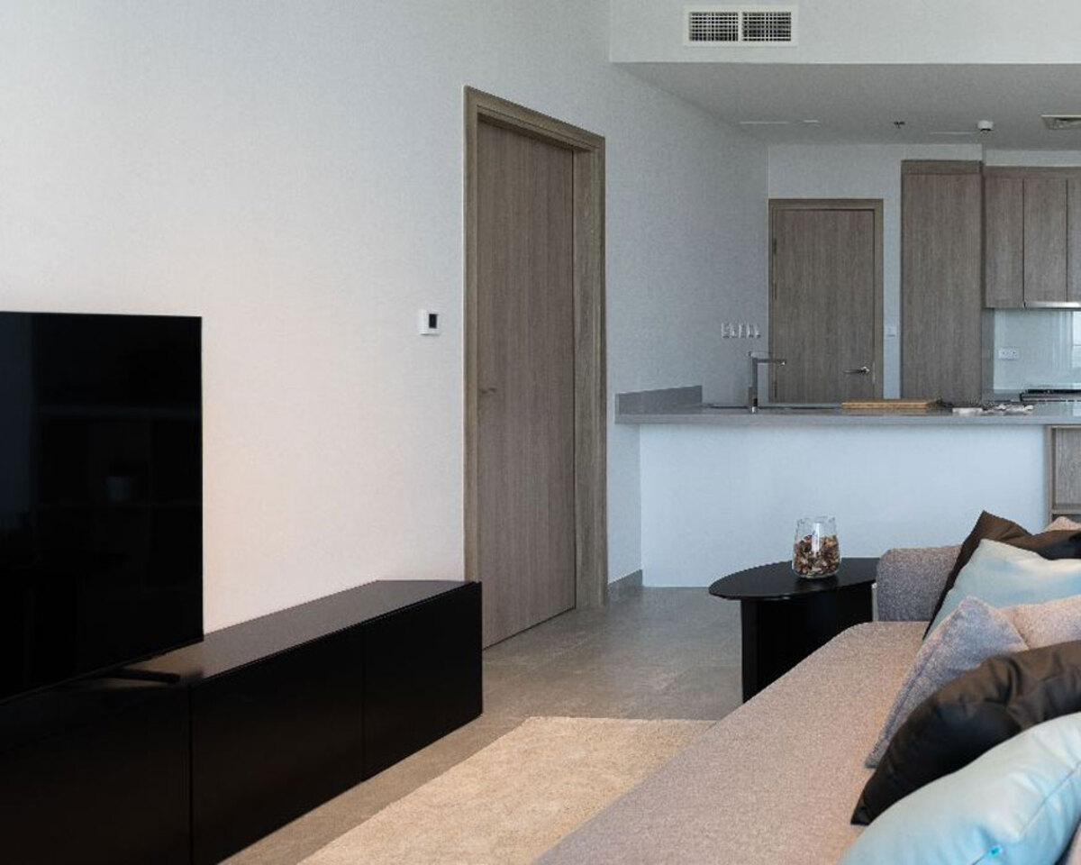 The apartment's design maximizes natural light, creating a bright and airy ambiance.